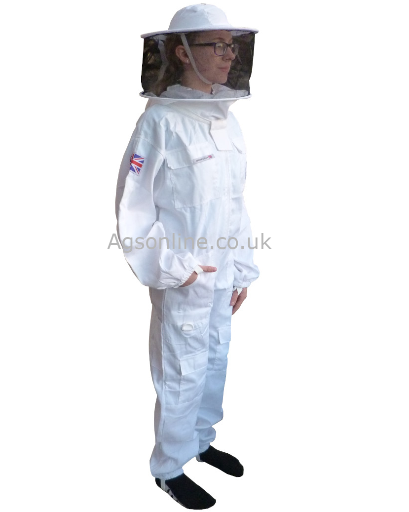 Three-quarter view of child in white cotton children's bee suit, round hat veil