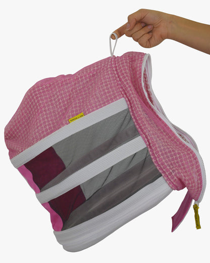 Detached fencing veil from pink PRO bee suit held up by its top loop