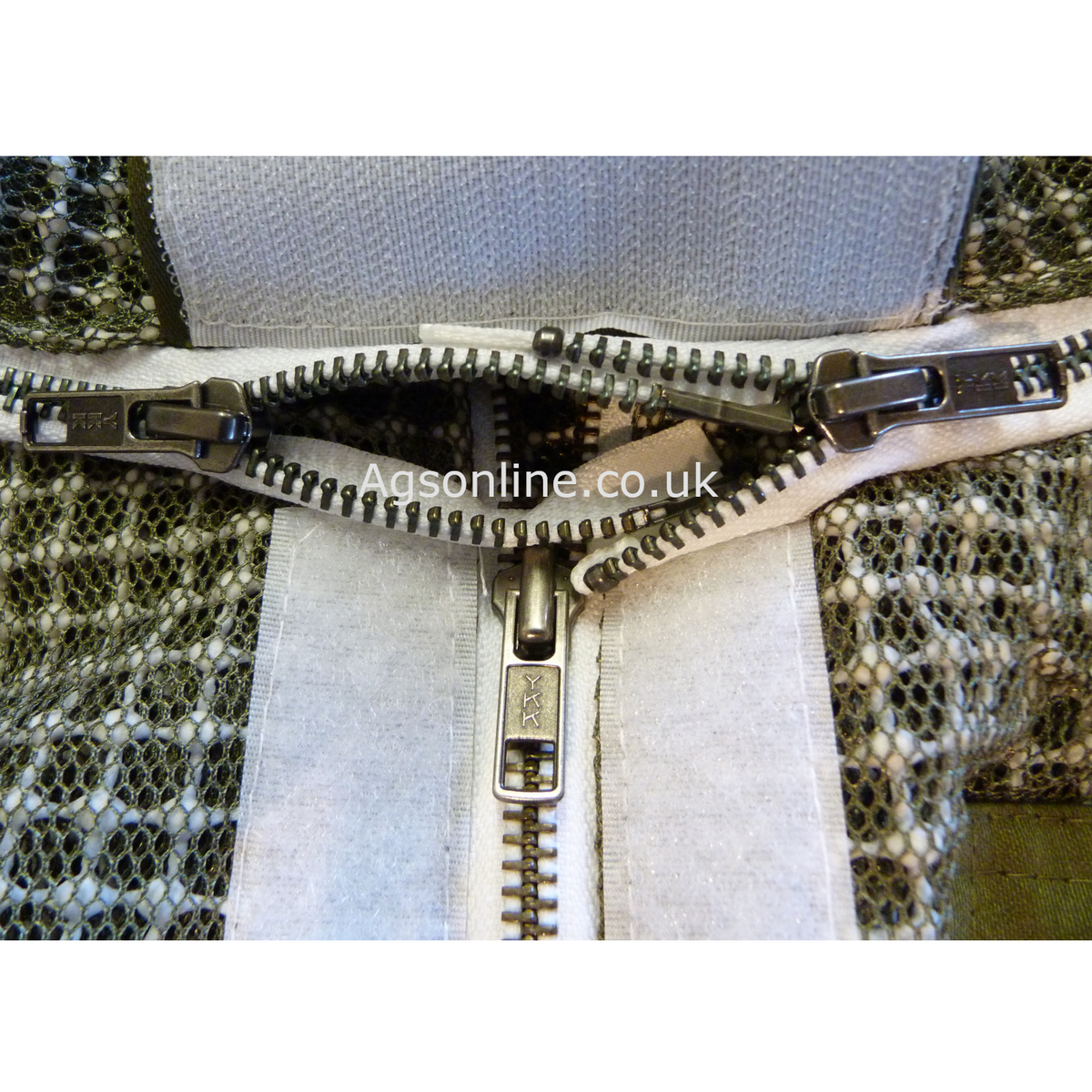 Close-up of metal zips on green 3 layer ventilated bee suit